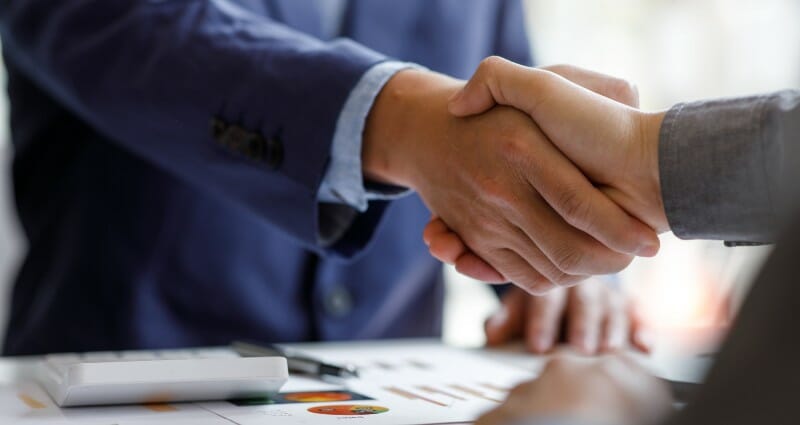 Men shaking hands in a business proceeding